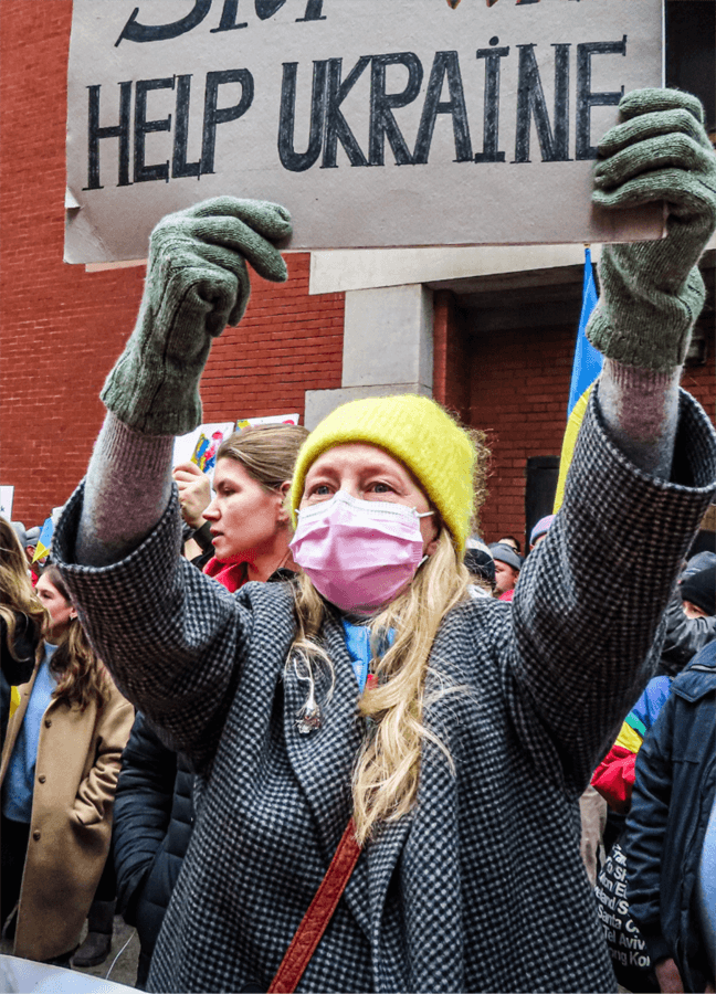 Woman holds up 'help Ukraine' sign