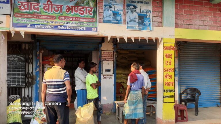 Farmers testing TILES oustide a shop that sells seeds and an electronics shop, Bihar, India