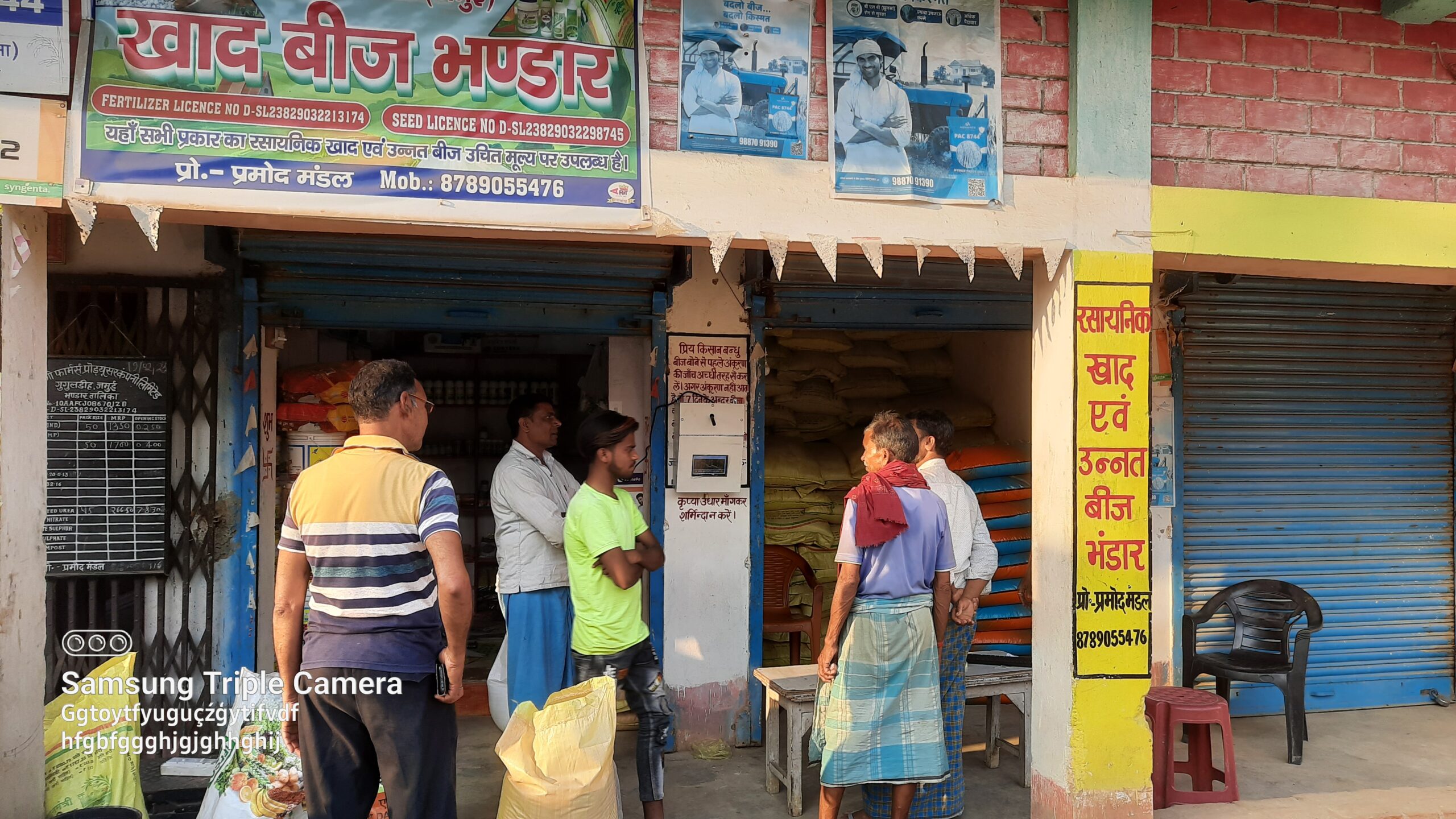 Farmers testing TILES oustide a shop that sells seeds and an electronics shop, Bihar, India