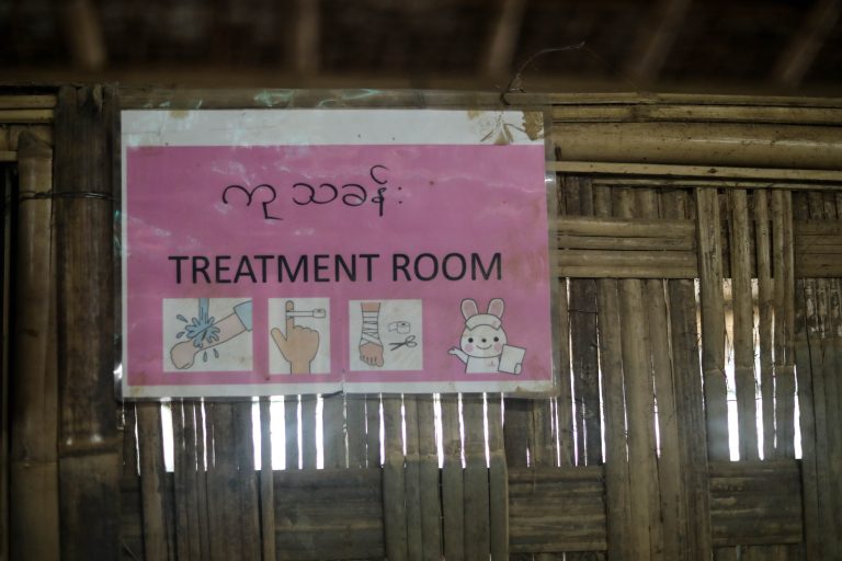 Pink sign reads Treatment Room with pictorials showing minor injuries