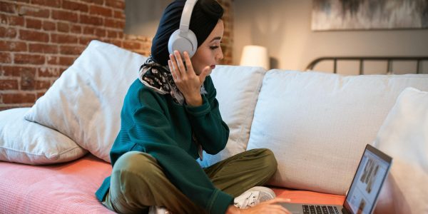woman on laptop with headphones